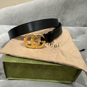 Gucci Black and Gold Belt with Iconic GG Buckle